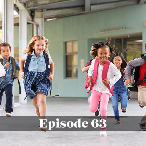 Children running through public school hallway