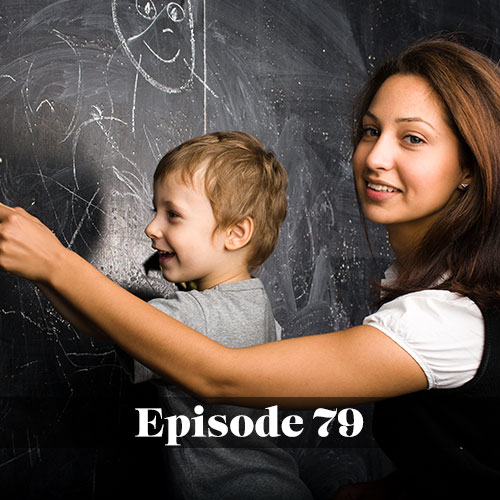 Female teacher with a male student at the chalkboard related to the effects of poverty on learning