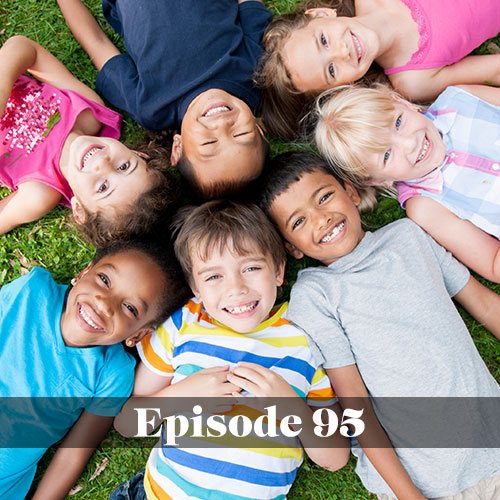 Pre-kindergarten in public schools, group of pre-K students laying in the grass and smiling