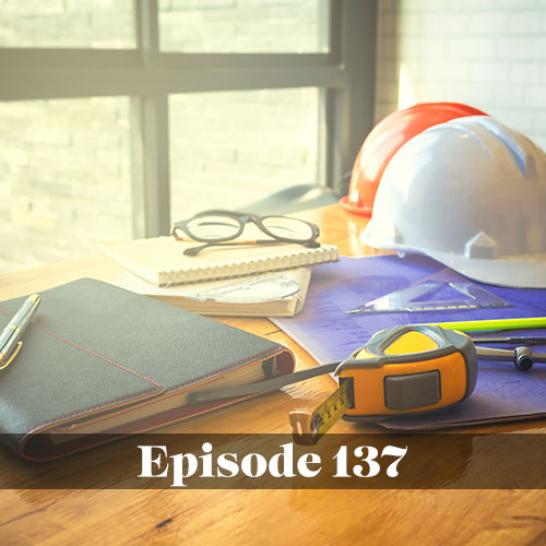 Construction hard hats with notebooks